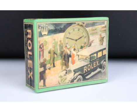 A Rolex pocket watch box with advertising graphics to all sides. 