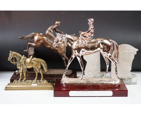 Two horse racing trophies together with a brass door stop in the form of a horse and a pair of horse head book ends. 