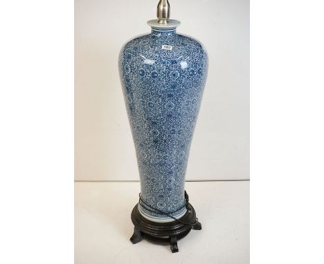 Large Chinese blue &amp; white ceramic standard lamp, of shouldered form, scrolling floral &amp; foliate decoration, with sha