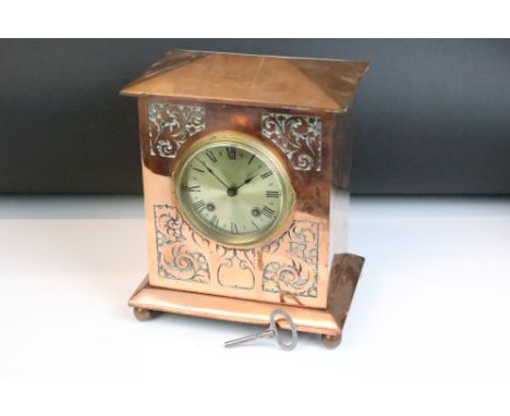 Late 19th / early 20th century copper mantle clock, with scrolling Acanthus leaf panels to front, vacant cartouche, the brass