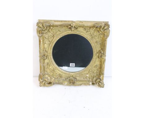 19th century Wall Mirror with circular plate, the gilt and gesso frame with moulded swept and scrolling leaf decoration, 51cm