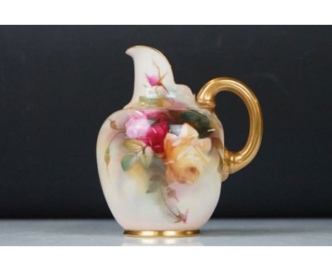 Royal Worcester jug with hand painted Rose decoration, signed R Austin, gilt handle, date code for 1897, measures approx 11.5
