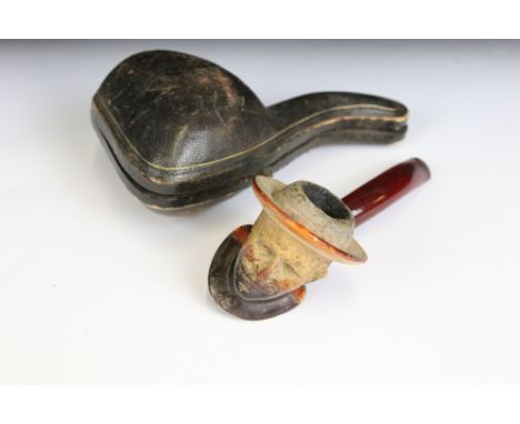 An antique meerschaum pipe with the bowl carved as a gentleman wearing a hat, silver collar and original case. 