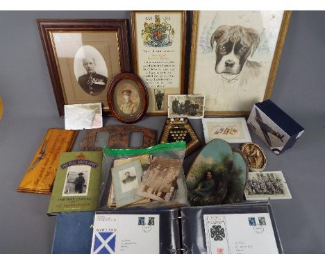 A collection of military related items to include photographs, framed silk postcard, first day covers and similar.