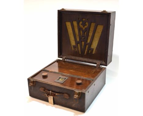 Early 20th century portable radio, Portadyne, the square case with hinged cover with pierced and fabric backed speaker over a
