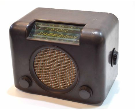 Mid-20th century Bakelite radio, Bush Radio, AC-DC Mains receiver, type DAC90, the all brown case with glazed dial and woven 