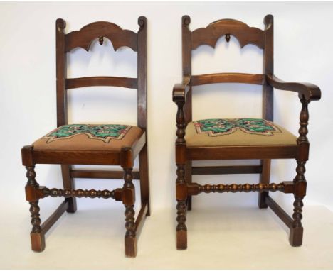 Set of eight mid-20th century oak framed bar back dining chairs with arched top and bobbin turned supports with embroidered d