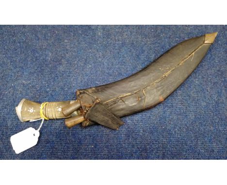 Second half of 20th century horn handled Kukri of typical form with aluminium lion mask pommel and prick engraved blade in a 