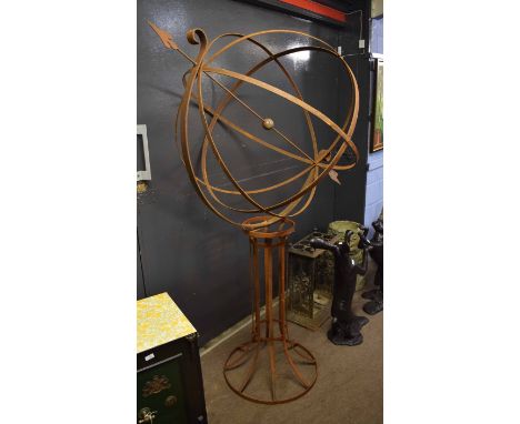 Metal strap work revolving garden sphere with an arrow through the centre on a splayed circular strap work stand, globe 163cm