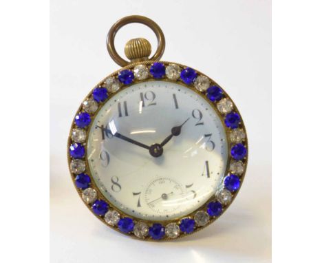 Mixed Lot: comprising an early 20th century brass and paste set "Bullseye" keyless desk timepiece, the circular case with dem