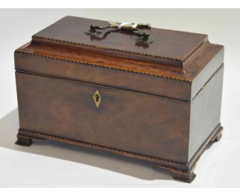 Early 19th century mahogany tea caddy with ogee top, central carry handle enclosing a three-section interior (void) on bracke