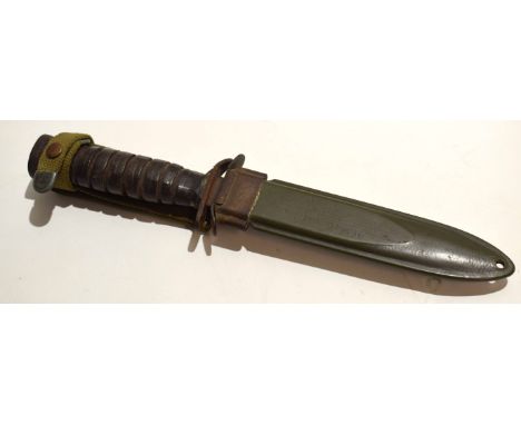 **USA M3 fighting knife with single edged blade with spear point and stamped "US, M3 Case" to a shaped cross guard and lamina