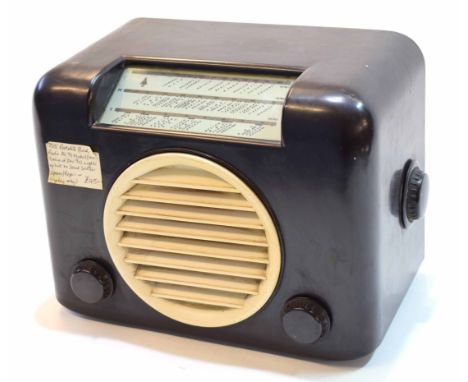 Mid-20th century Bakelite radio, Bush Radio, A C Mains receiver, type AC91 with brown cased glazed dial and ivory speaker cov