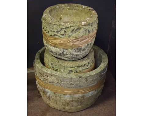 Pair of concrete planters with birds among vine decoration together with a further concrete barrel formed planter, largest 45