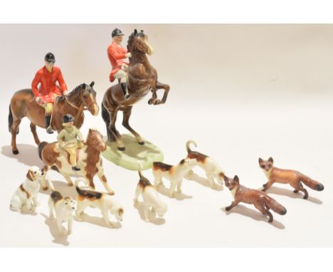 Group of Beswick hunting items including a huntsman in typical attire with a further huntsman on a rearing horse, model 868, 