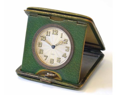 Early 20th century green leather and gilt highlighted folding travel clock, the polished case with contemporary initials to a