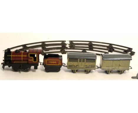 Boxed Brimtoy tin plate 0 gauge train set comprising train, tender, two goods vans and track, size 25cm x 34cm (lacking lid)