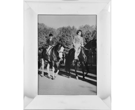 Empress Farah Diba and Crown Prince Reza ride on the grounds of the Palace at Saadabad, original press photograph [probably N