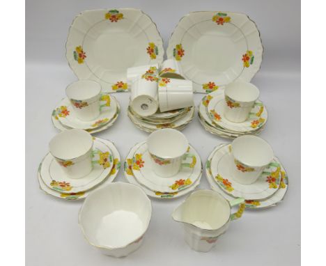 Art Deco Royal Stafford tea service for eight painted with nasturtium  with floral moulded handles 