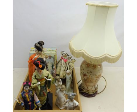 Three Nao figures, another similar, three Geisha doll models on stands, Japanese table lamp, 1980s Rupert annuals etc 