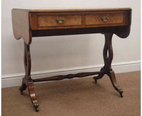 Edwardian walnut sofa table, two real and two false drawers, shaped supports joined by  stretcher, 135cm x 55cm, H77cm