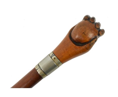 A 19th century Victorian malacca and mahogany walking stick cane. The walking stick featuring hand carved finial of hand hold