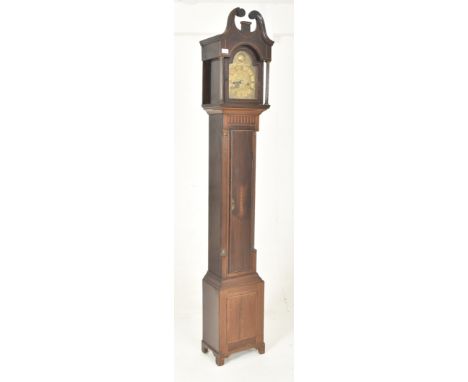 A late 18th century mahogany and brass faced double fusee longcase clock. The clock having scrolled swan neck pediment atop o