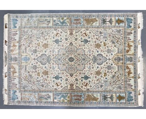 A Persian Tabriz Zir Khaki hand woven wool &amp; silk 60 raj floor carpet rug. The carpet having a central floral medallion w