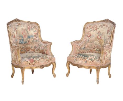 A pair of giltwood and upholstered armchairs in Louis XV style  A pair of giltwood and upholstered armchairs in Louis XV styl