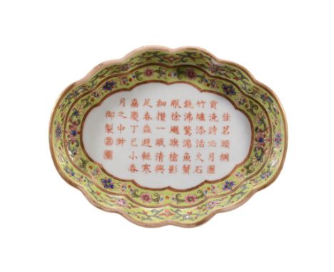 A Chinese famille rose lobed tea tray, rounded sides raised on four bracket...  A Chinese  famille rose   lobed tea tray,   r