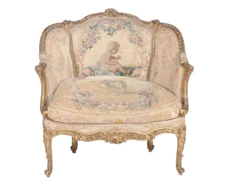A giltwood and tapestry upholstered armchair in the Louis XV style  A giltwood and tapestry upholstered armchair in the Louis