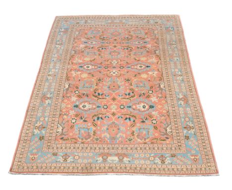 -108 A Persian carpet, with overall scrolling foliate design -108  A Persian carpet,    with overall scrolling foliate design