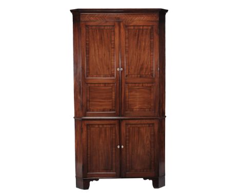 A George III mahogany corner cupboard , circa 1800  A George III mahogany corner cupboard  , circa 1800, the moulded cornice 