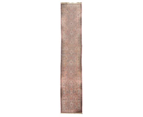 A north west Persian runner with all-over paterae design on a yellow ground  A north west Persian runner with all-over patera