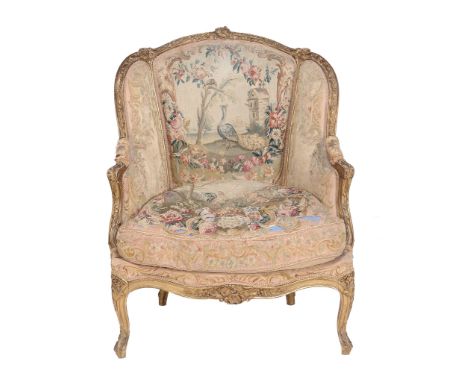 A giltwood and tapestry upholstered armchair in Louis XV style  A giltwood and tapestry upholstered armchair in Louis XV styl