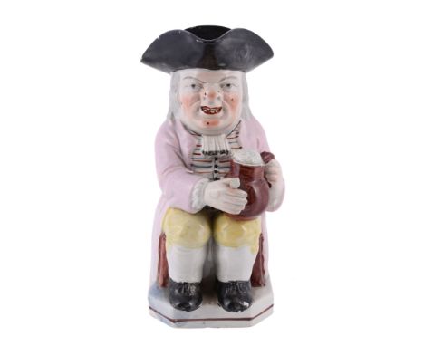 A Staffordshire pearlware Toby jug , first quarter 19th century  A Staffordshire pearlware Toby jug  , first quarter 19th cen