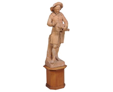 A late 18th century French large terracotta figure of a hurdy gurdy player...  A late 18th century French large terracotta fi