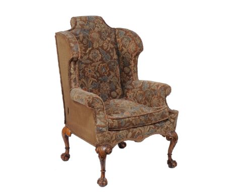 A tapestry upholstered wing back armchair in George I style  A tapestry upholstered wing back armchair in George I style  , l