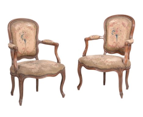 A pair of Louis XV stained beech and tapestry upholstered fauteuil, circa 1760  A pair of Louis XV stained beech and tapestry