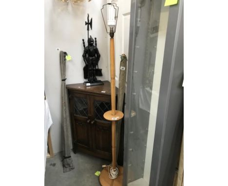 A turned wood lamp stand