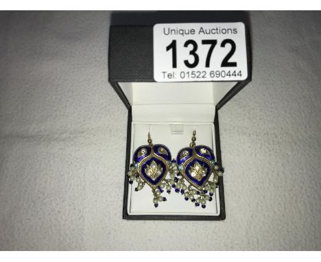 A pair of reversible basse-taille enamel pendant earrings fashioned as hearts, approximately 3 cm long.