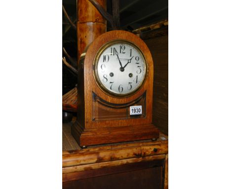 An Edwardian oak mantel clock with silvered dial by Dobson Gradon, Blackhill &amp; Consett.