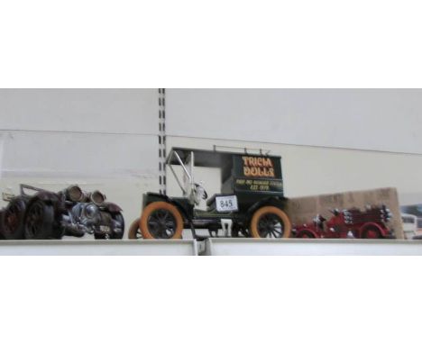 A pressed steel model Bentley, a tin plate model T Ford van and a model fire engine,