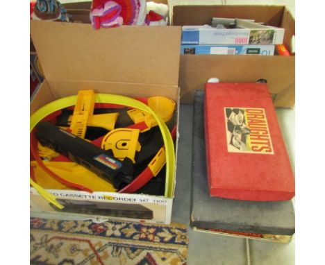 A quantity of Corgi rocket track together with Monopoly, Draughts and anti-monopoly.