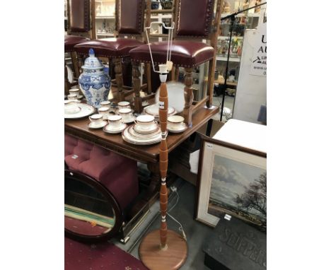 A turned wood lamp stand
