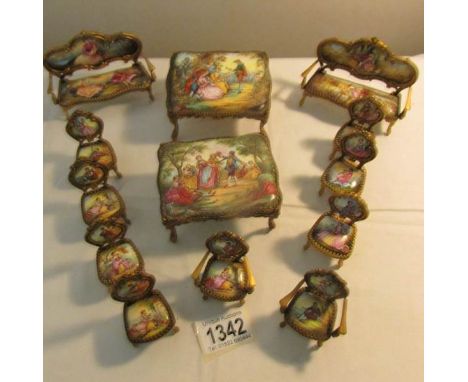 A collection of 13 pieces of Austrian enamel miniature furniture.