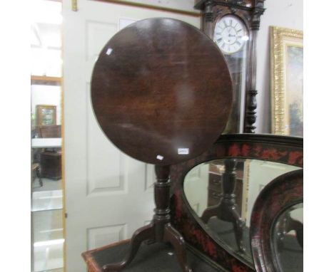 An oak tip top tripod table.