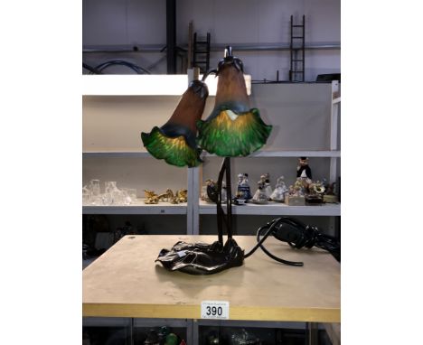 An art nouveau table lamp with double flower shades