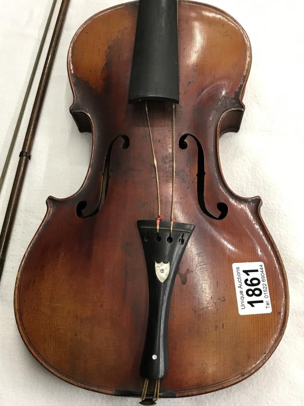 An old violin, stamped Stainer, complete with bow.