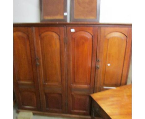 A mahogany 4 door bookcase.